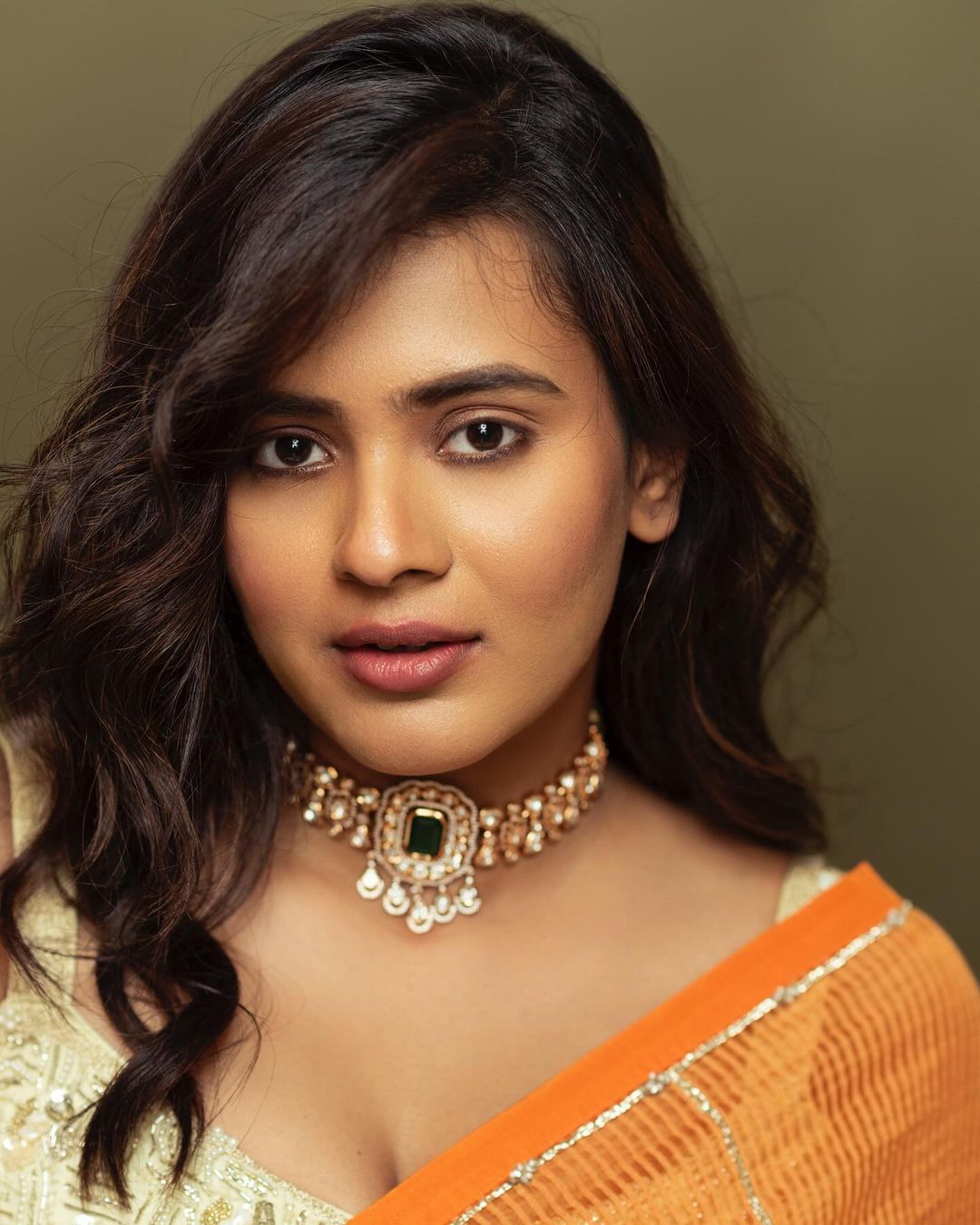 Indian Actress Hebah Patel Stills in Orange Saree